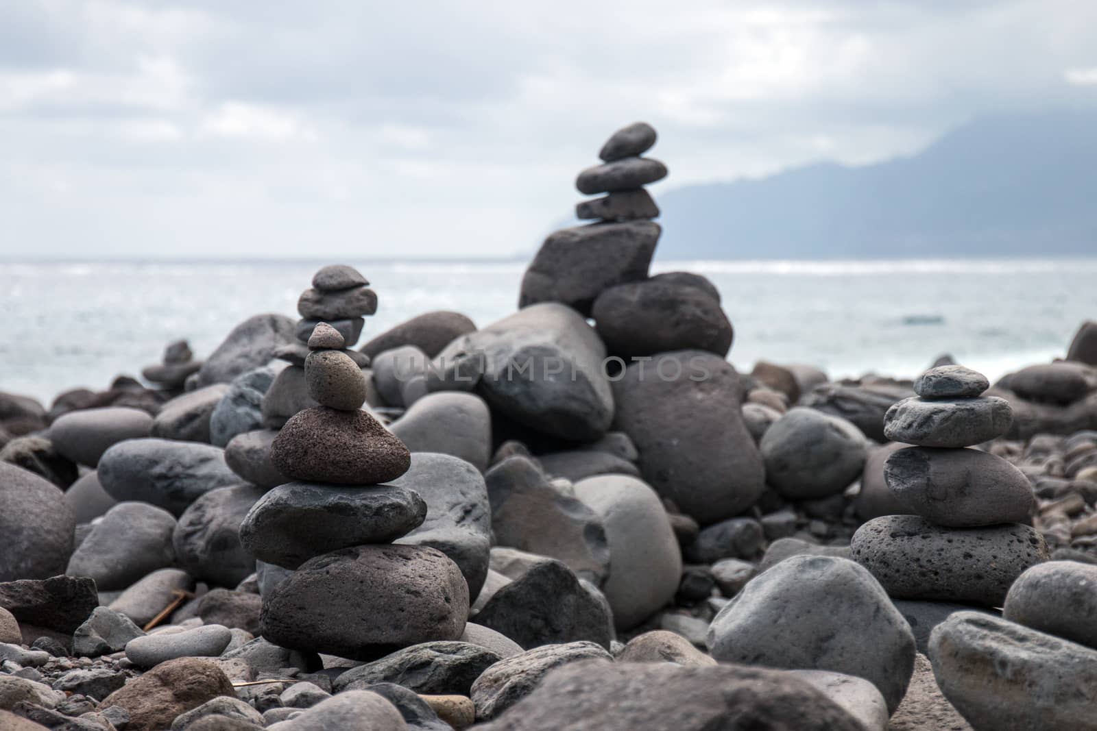Zen style balanced stones on Ribeira da Janela beach, Madeira island, Portugal.
