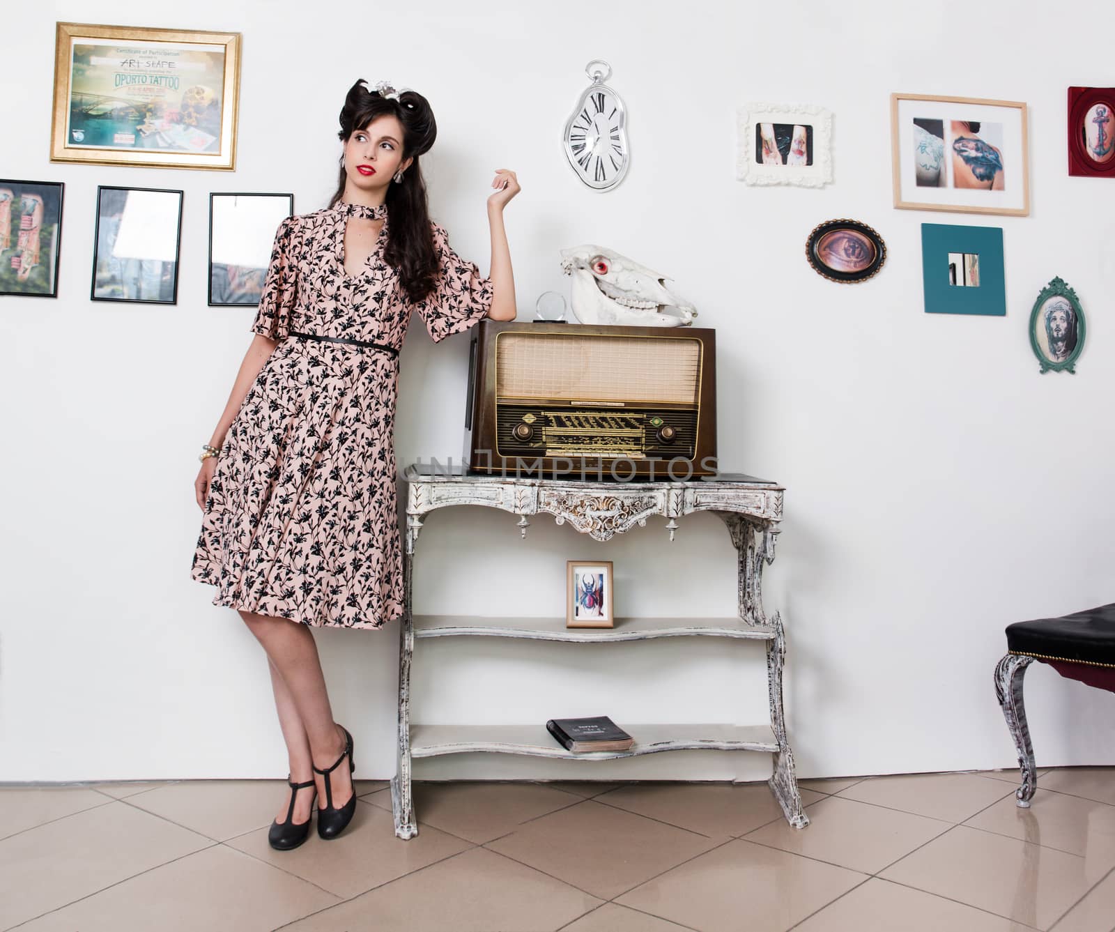 Woman posing with a vintage style retro floral clothing.