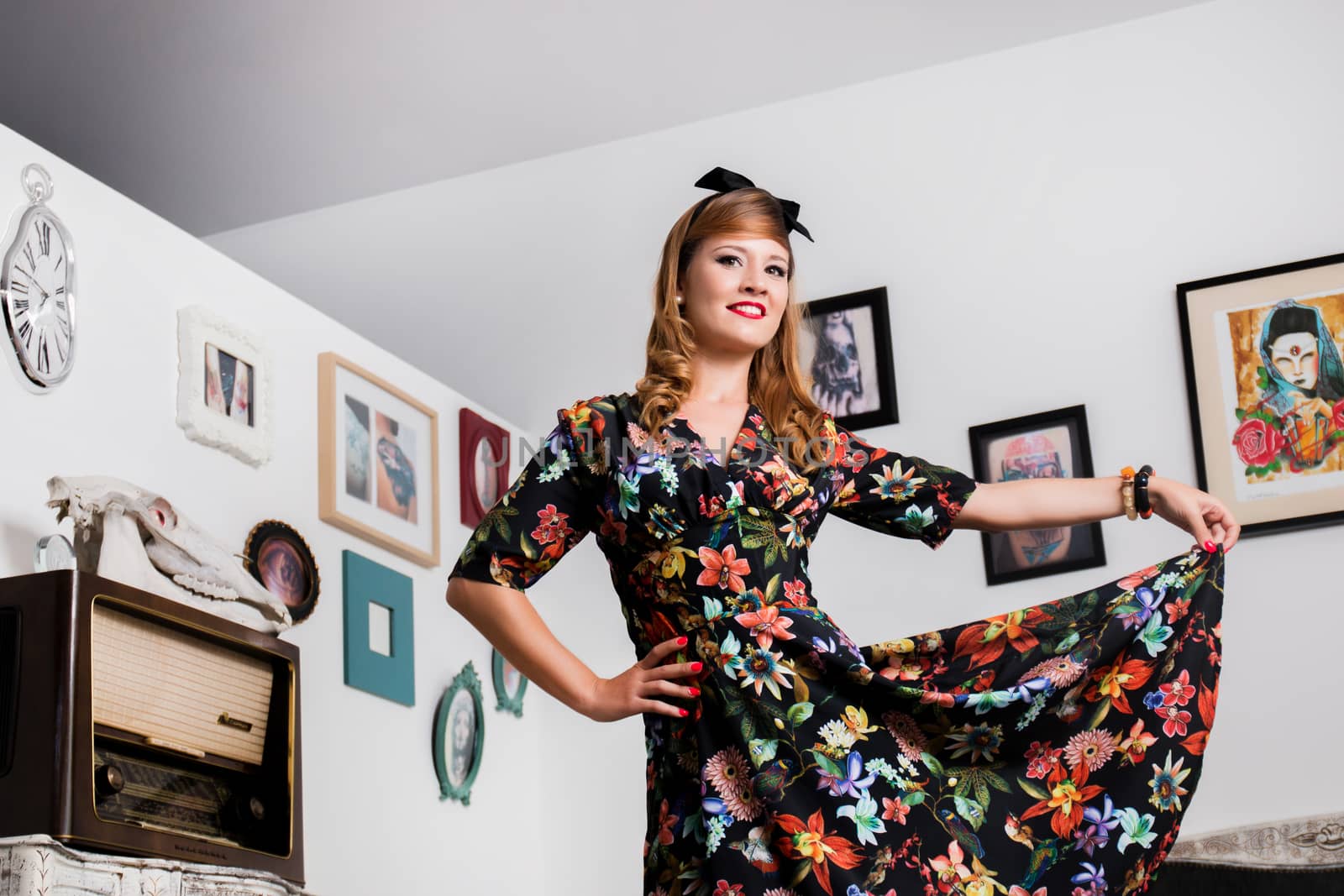 Woman posing with a vintage style retro floral clothing.