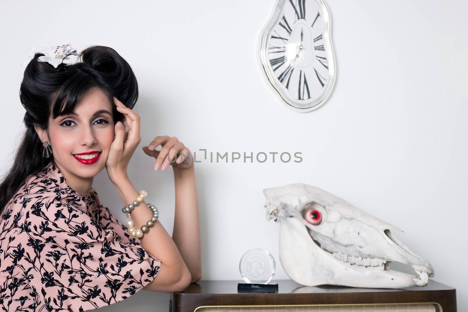 Woman posing with a vintage style retro floral clothing.