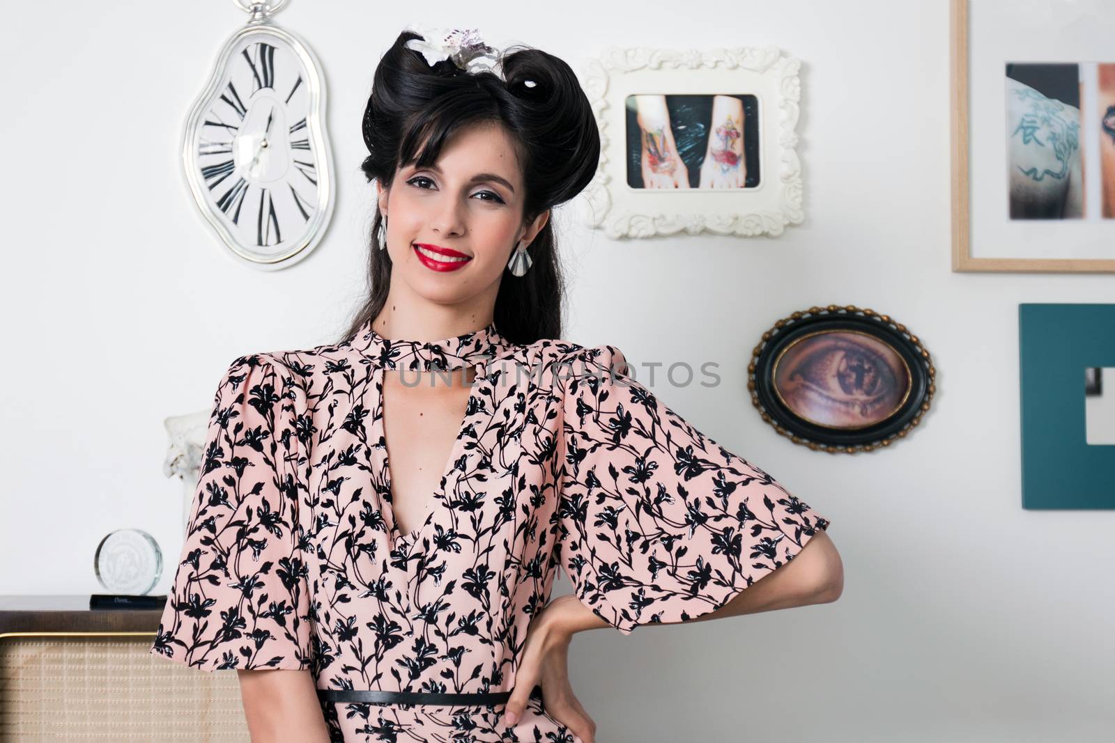 Woman posing with a vintage style retro floral clothing.