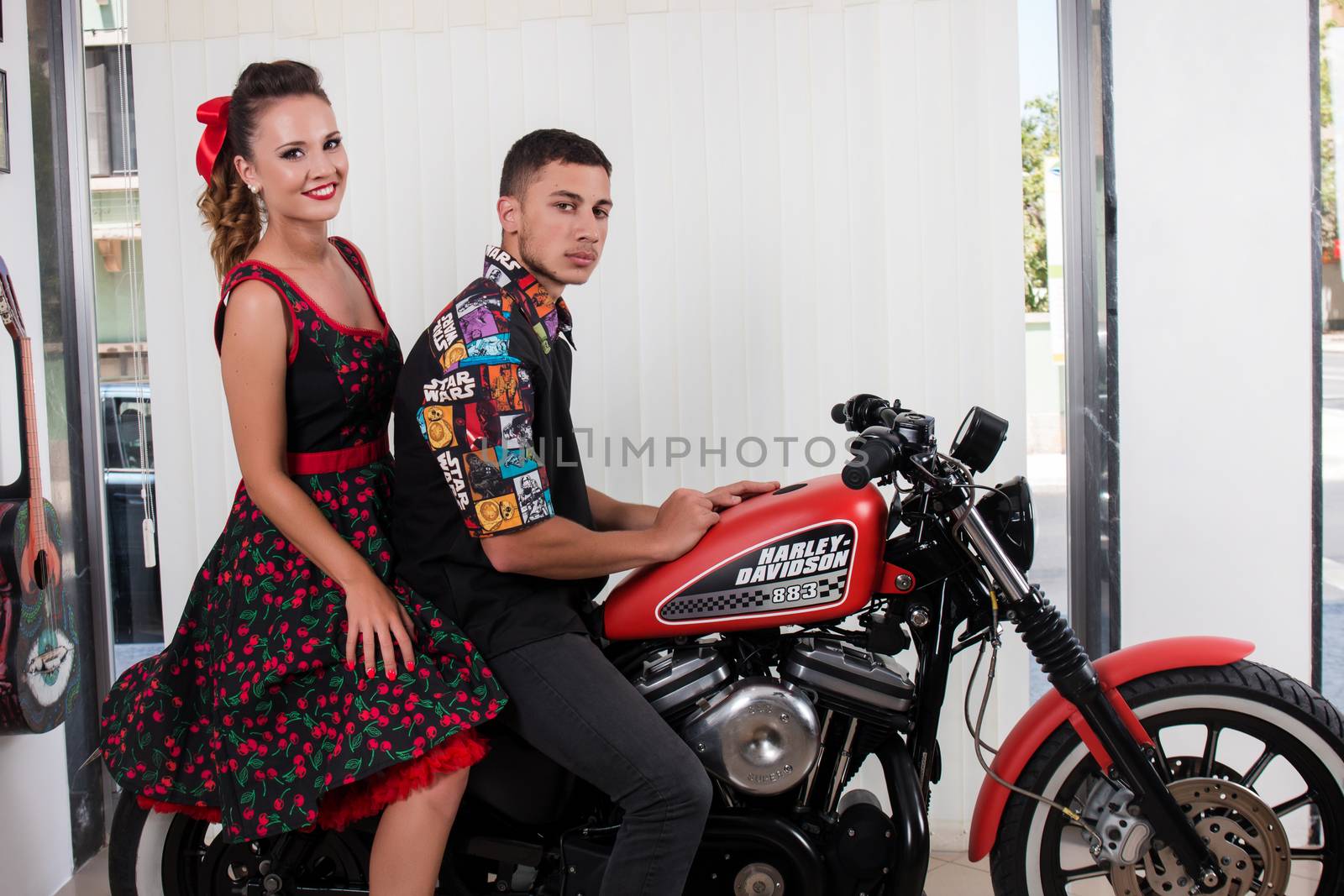 Vintage couple in a motorbike by membio