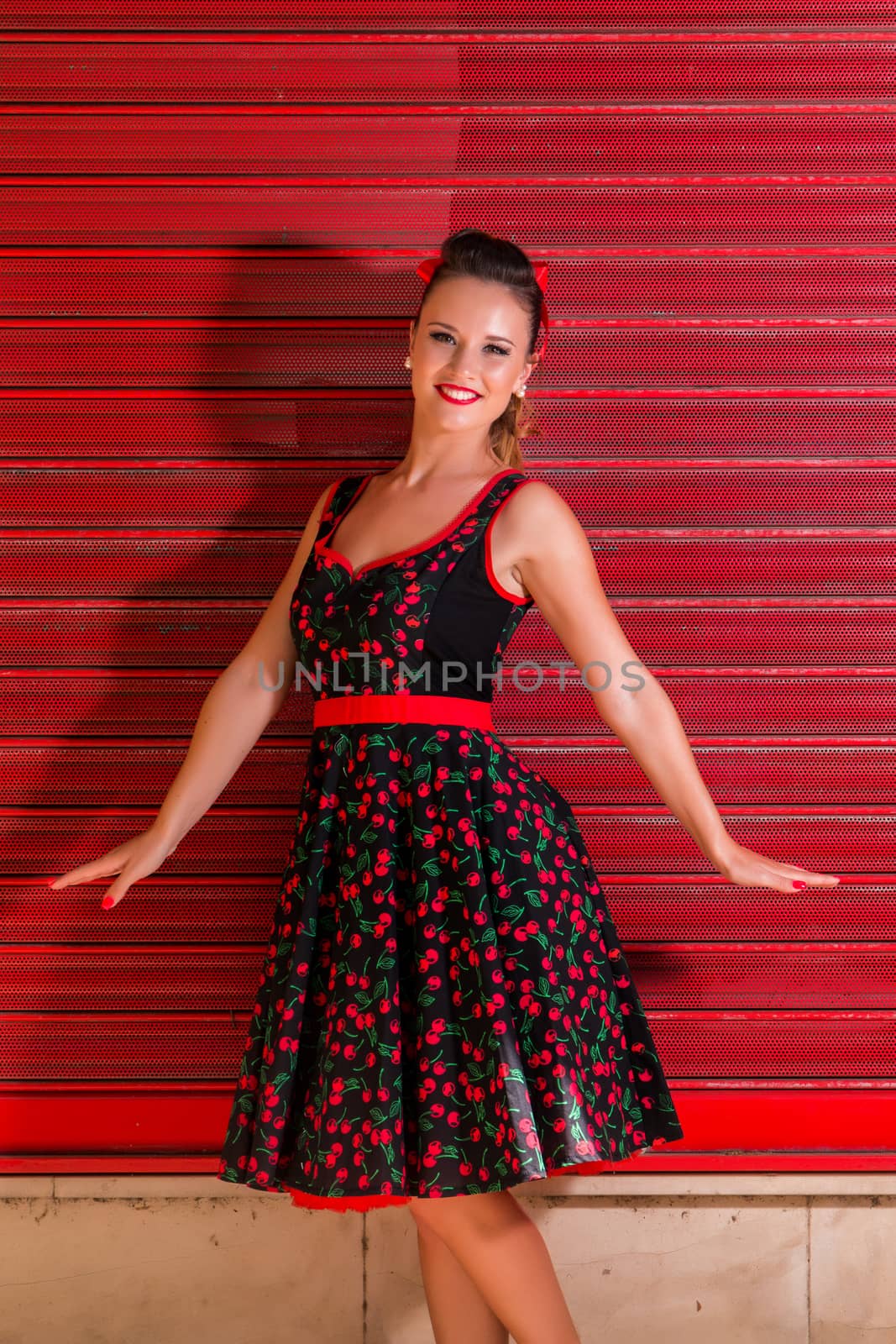 Woman posing with a vintage style retro floral clothing.