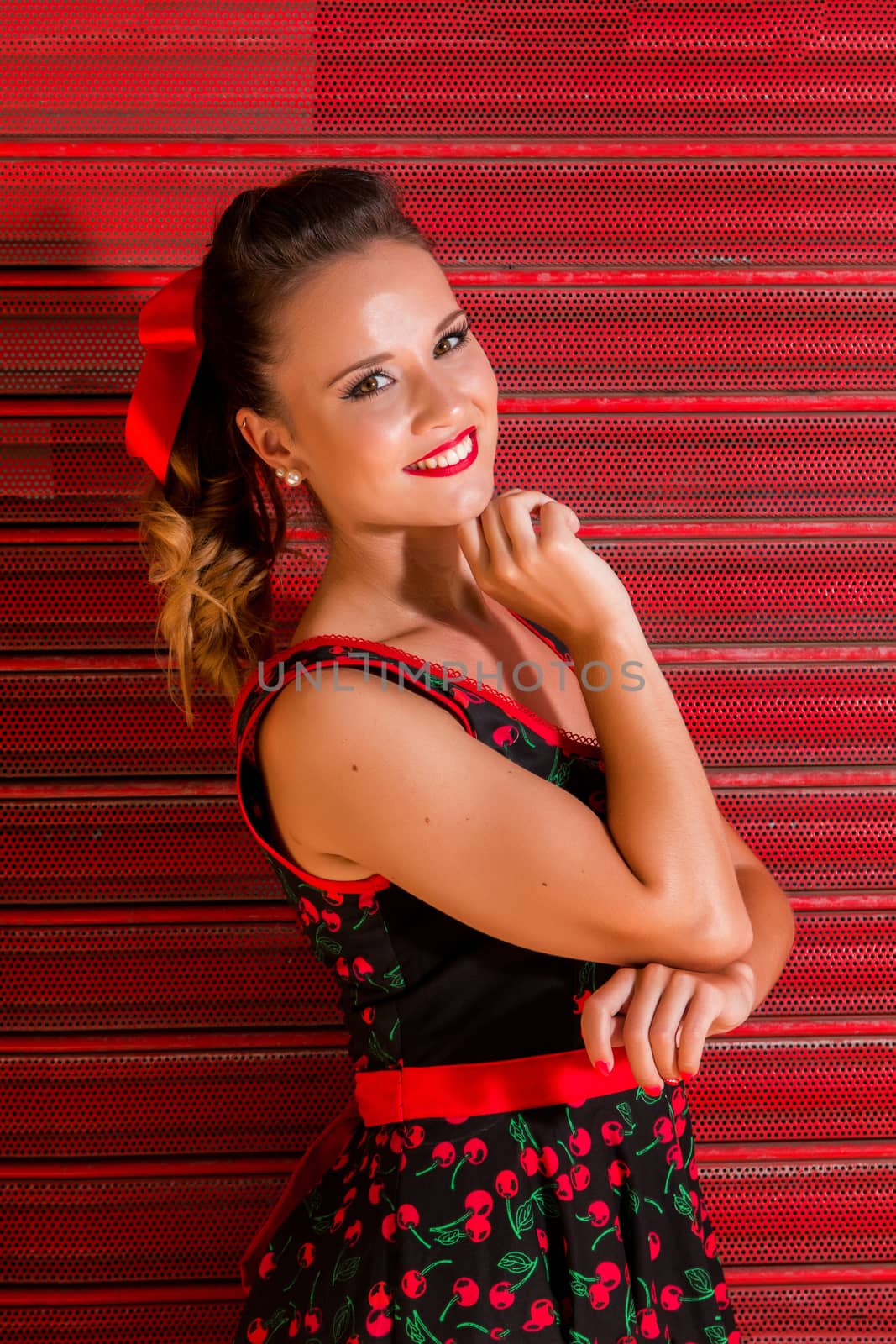 Woman posing with a vintage style retro floral clothing.