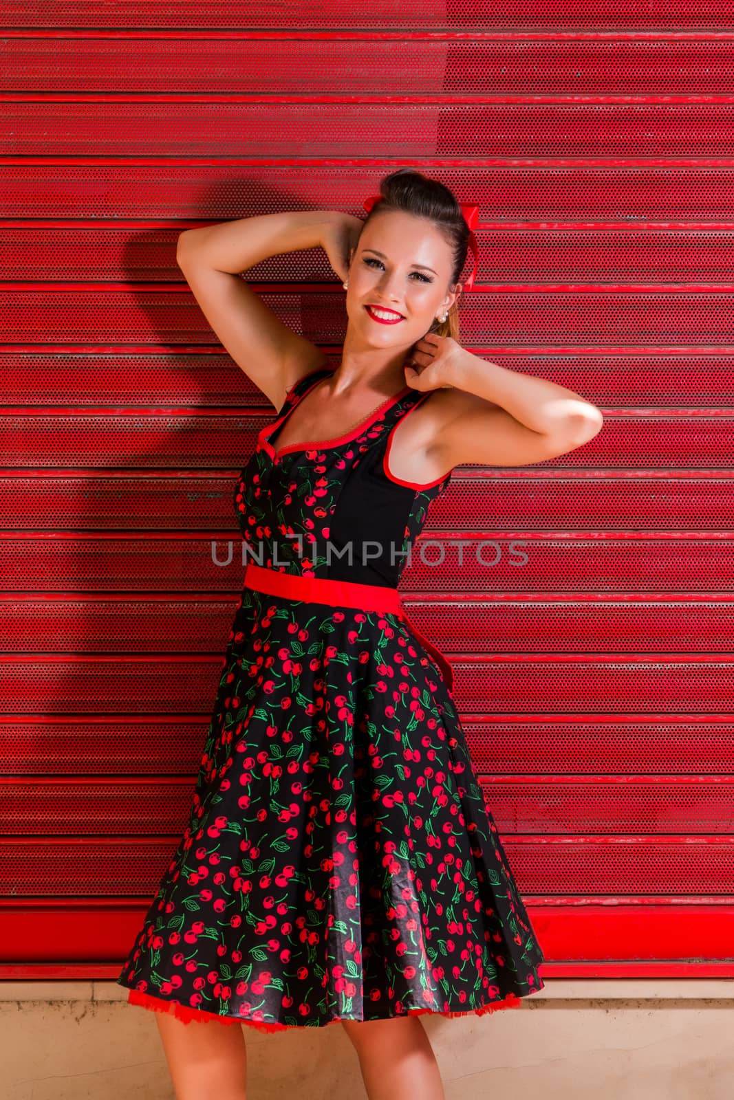 Woman posing with a vintage style retro floral clothing.