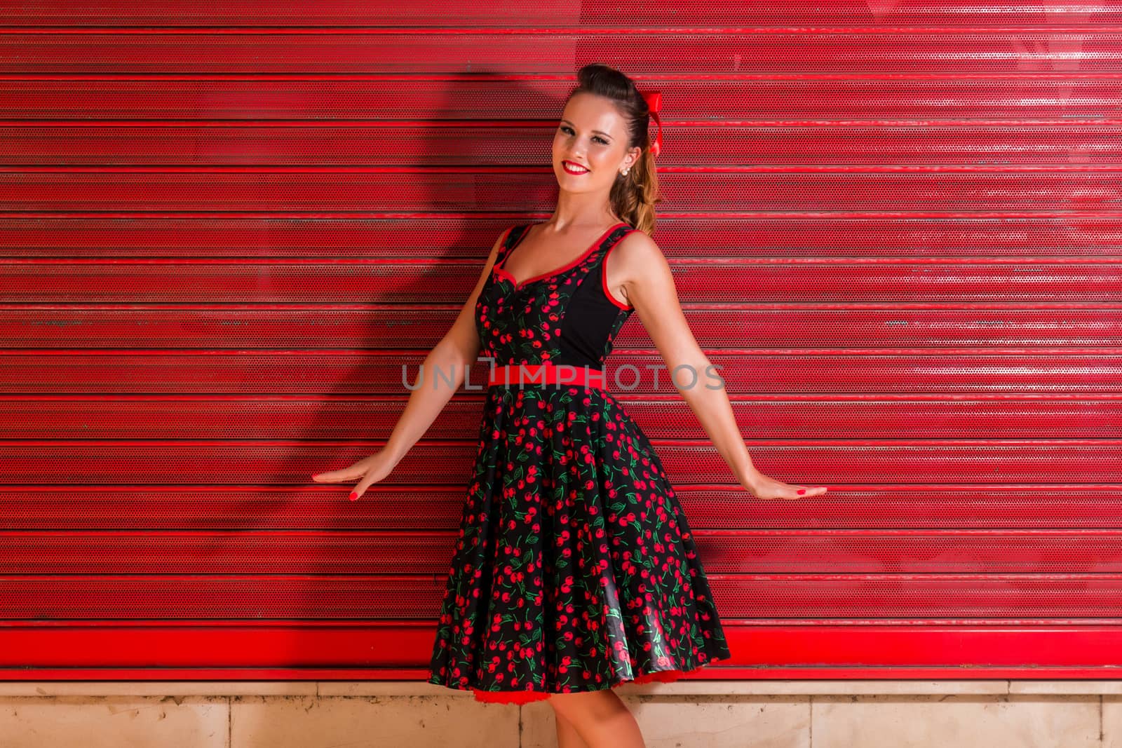 Woman posing with a vintage style retro floral clothing.