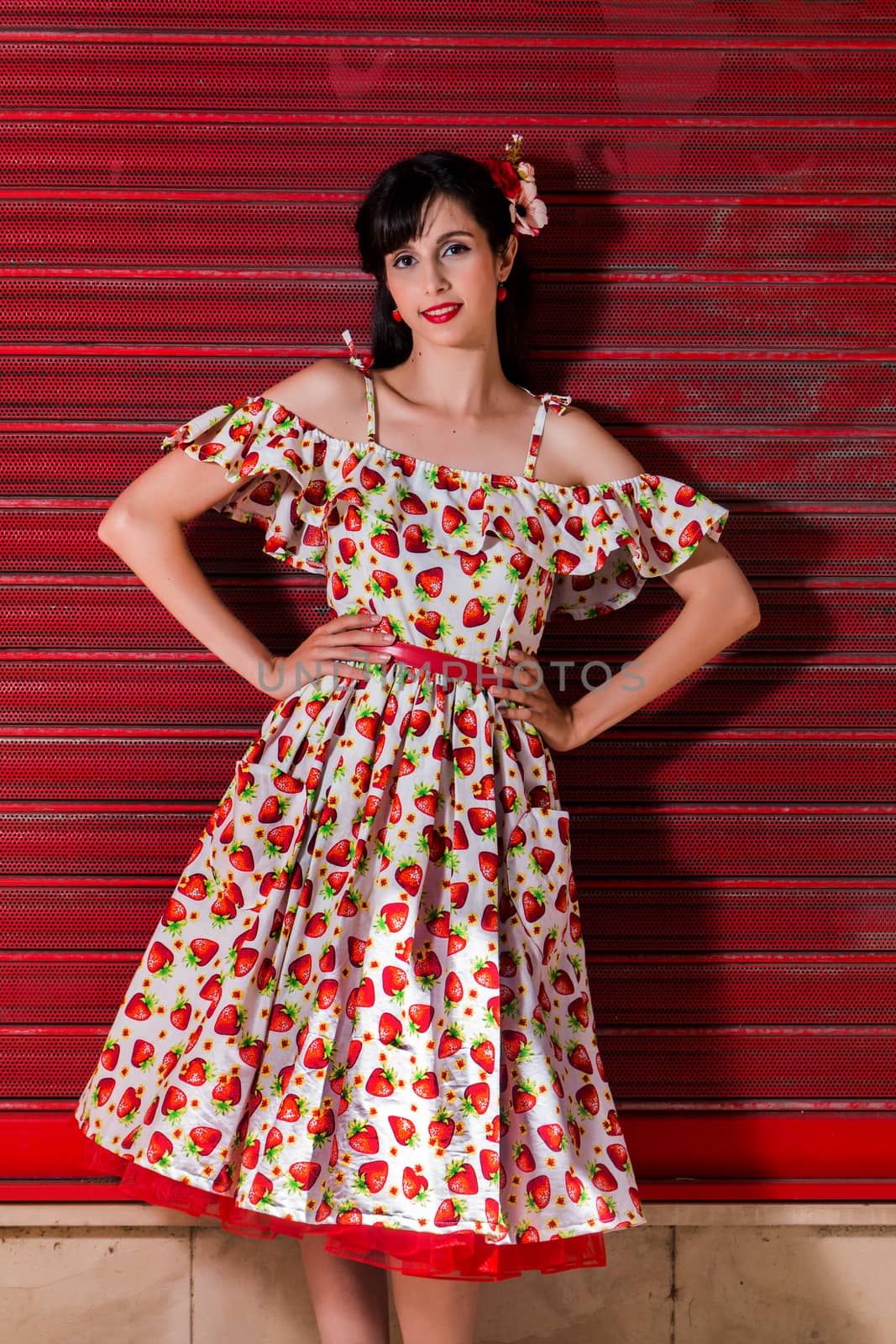 Woman posing with a vintage style retro floral clothing.