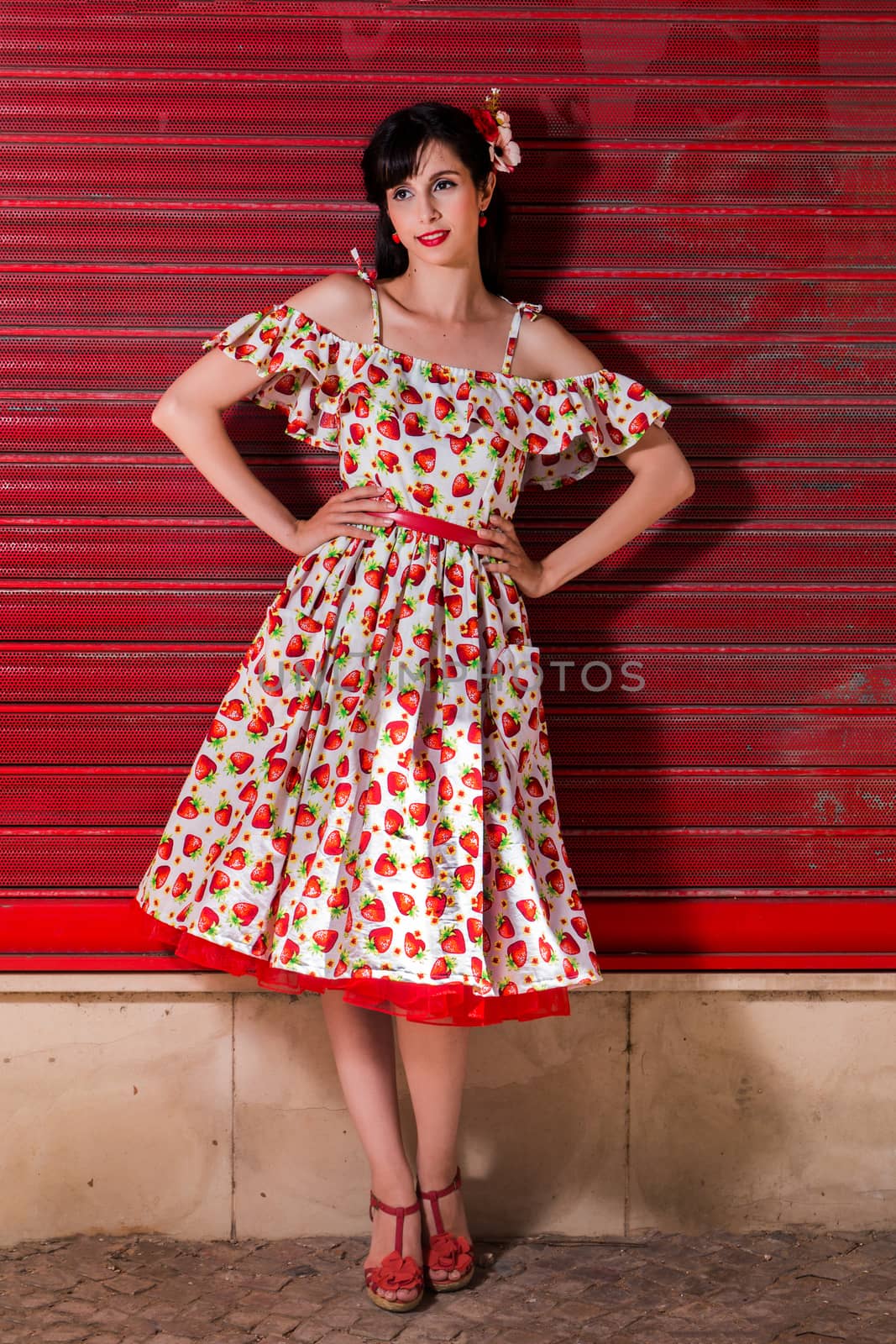 Woman posing with a vintage style retro floral clothing.