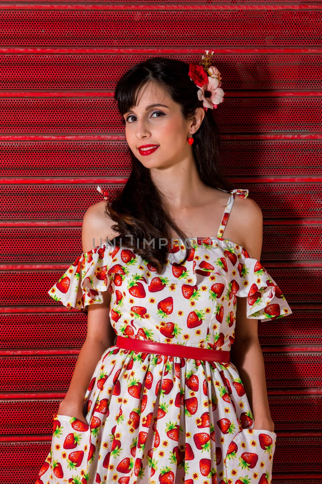 Woman posing with a vintage style retro floral clothing.