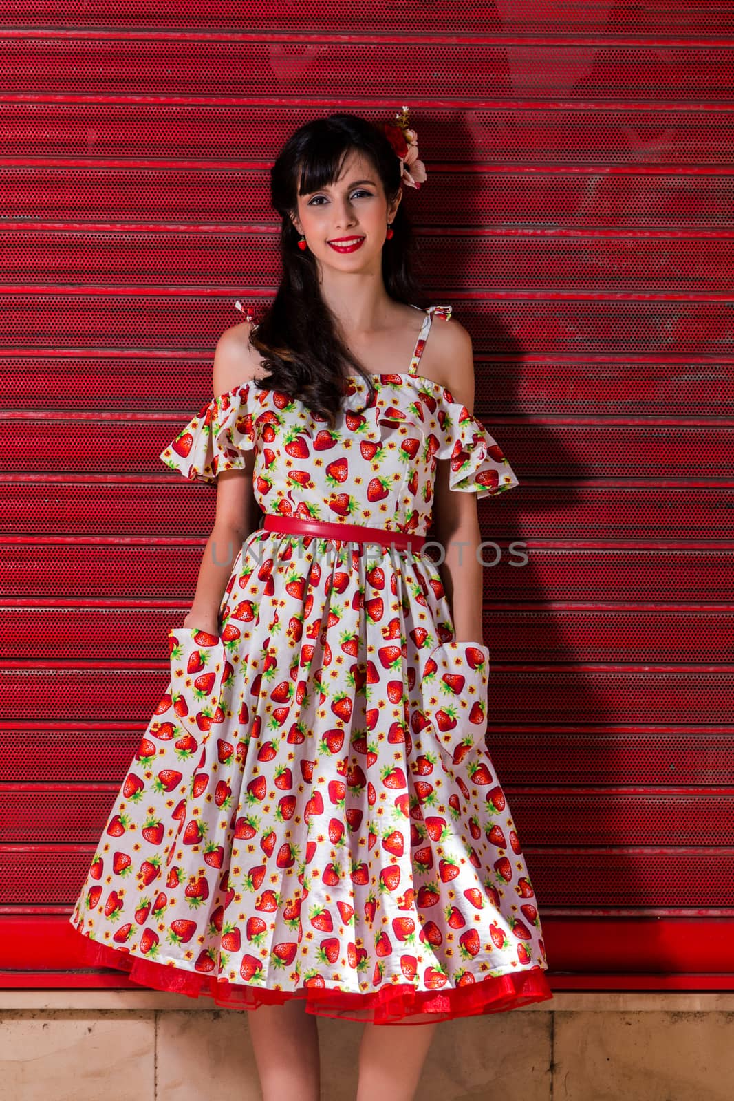 Woman posing with a vintage style retro floral clothing.