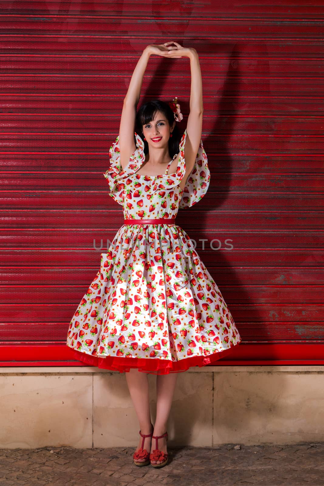 Woman posing with a vintage style retro floral clothing.