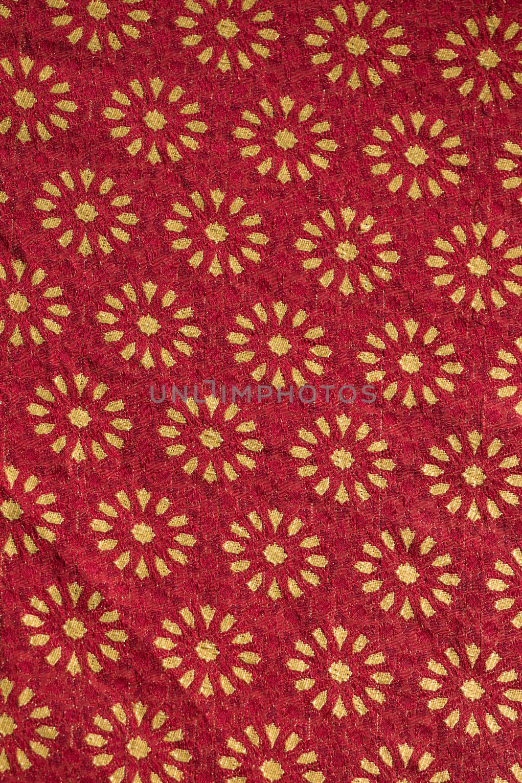 Close up view of Traditional red  and golden medieval fabric design.