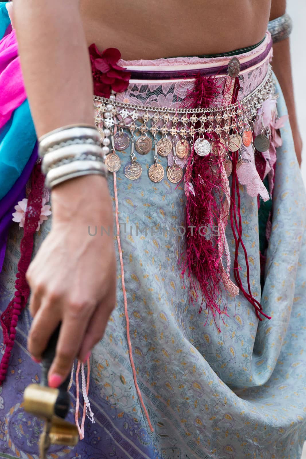 Detail view of the dress of belly dancer girl.