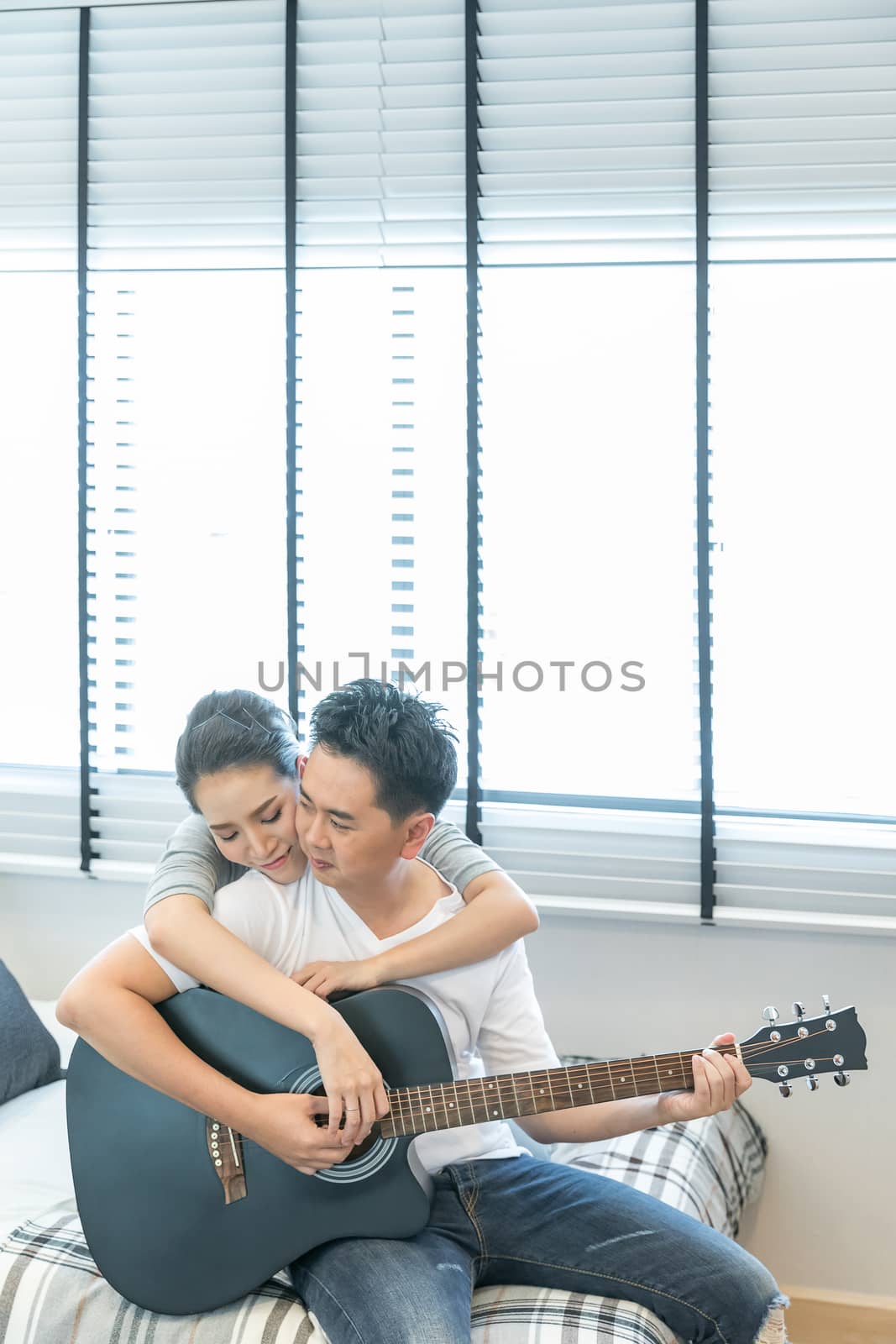 Couples playing guitar by vichie81