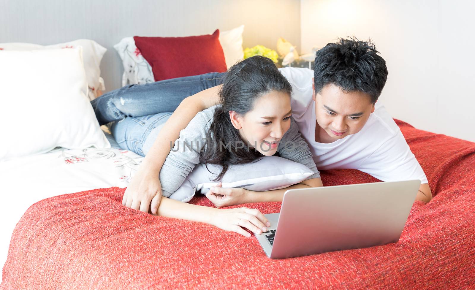 Couples using laptop bedroom by vichie81