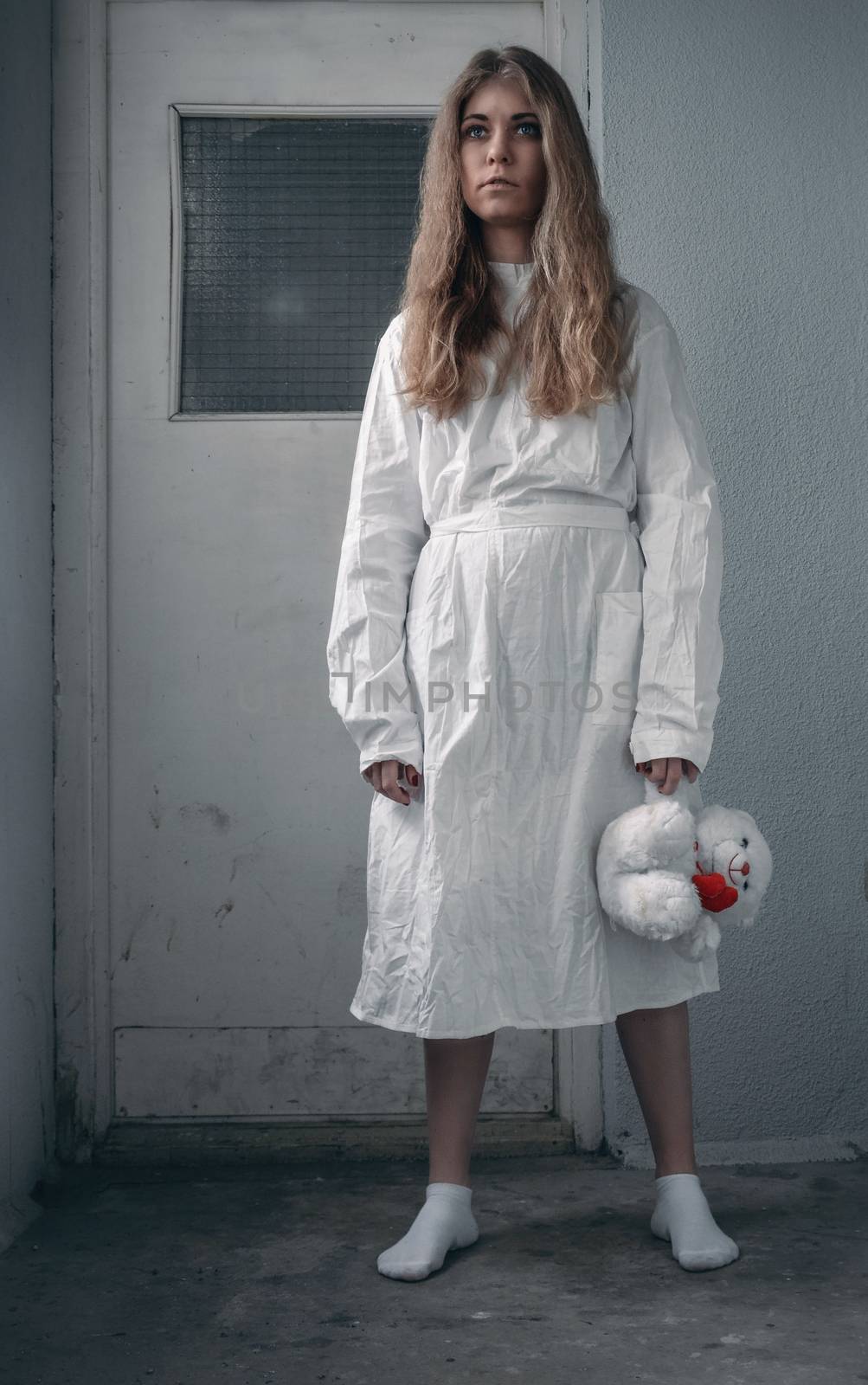 mentally ill girlwith a straitjacket in a Psychiatric
