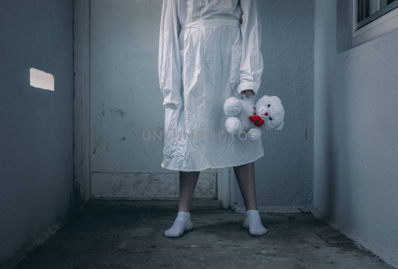 mentally ill girlwith a straitjacket in a Psychiatric