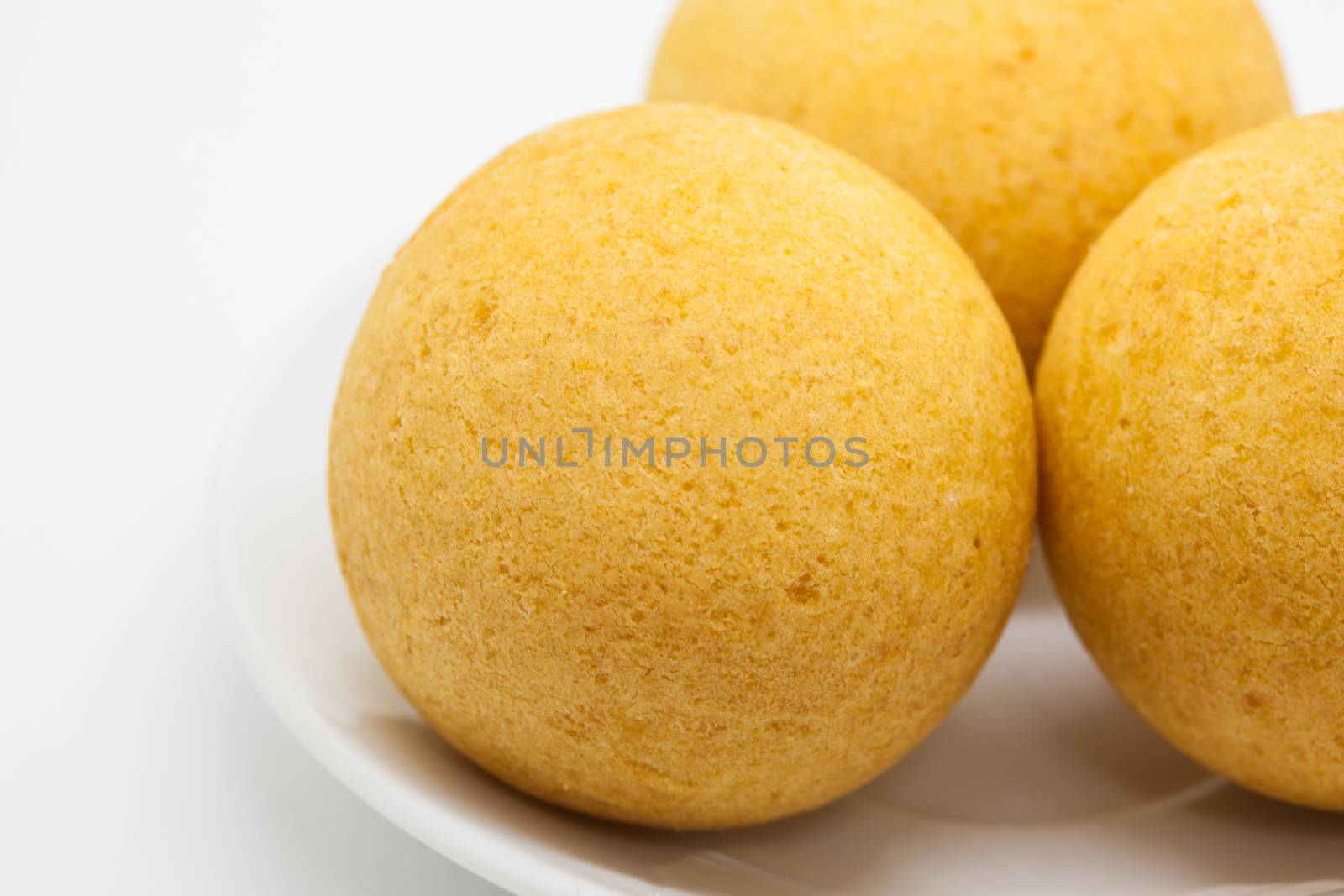 Traditional Colombian buñuelos (Deep Fried Cheese Bread) isolated on white background