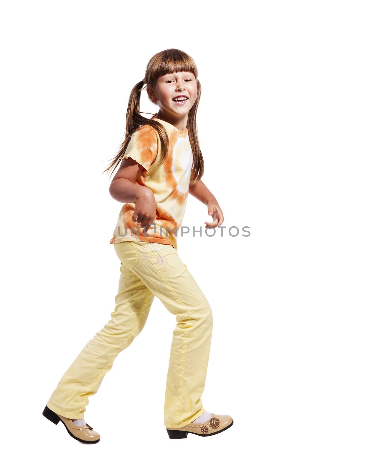 Happy excited walking girl isolated on white