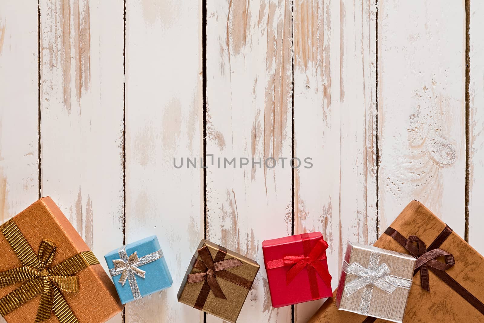 Christmas presents over a rustic wooden table by LuigiMorbidelli