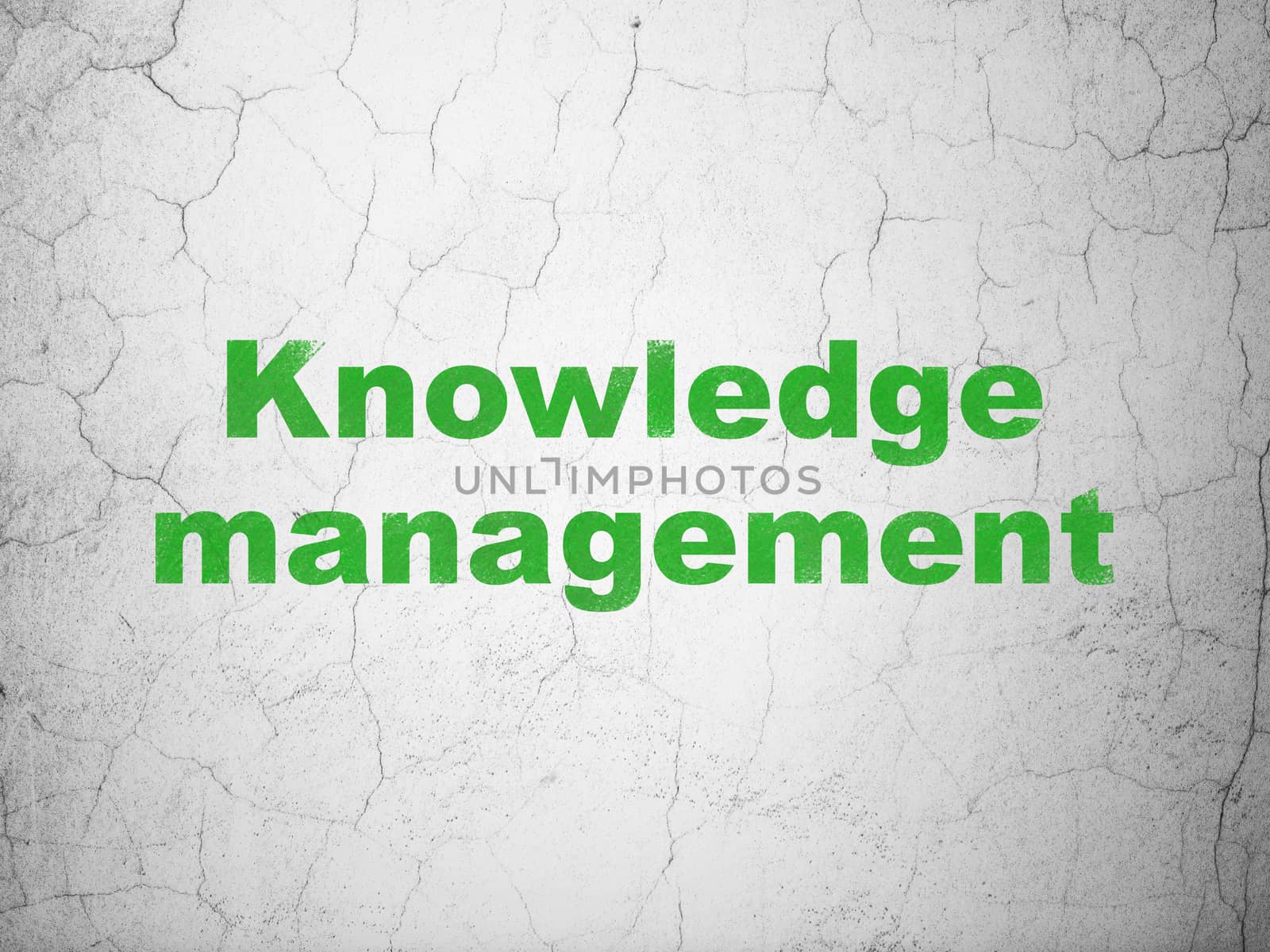 Learning concept: Knowledge Management on wall background by maxkabakov
