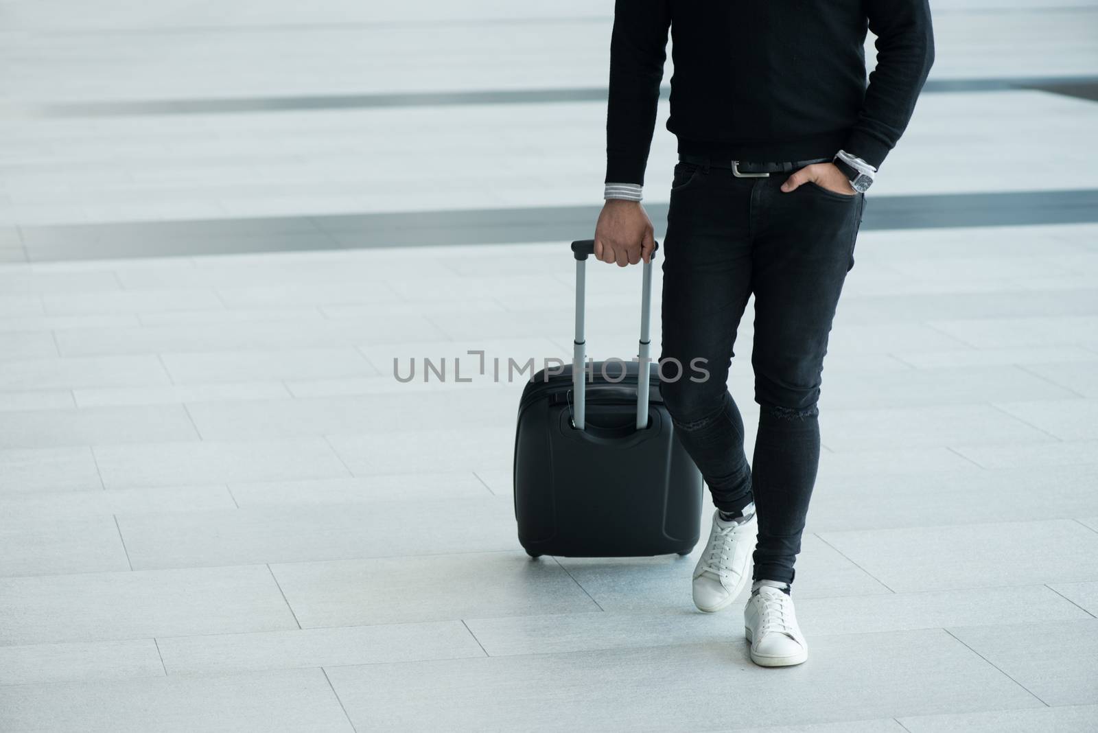 Man walking with wheeled bag by ALotOfPeople