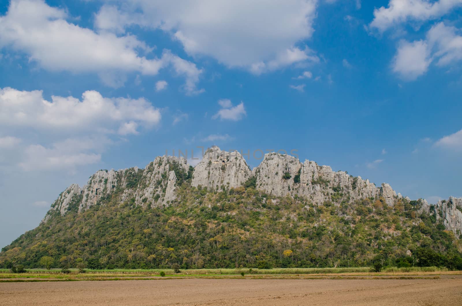 Kao Nor Kao Kawg is limestone mountain in Nakon sawan Province and have green paddy ,blue sky