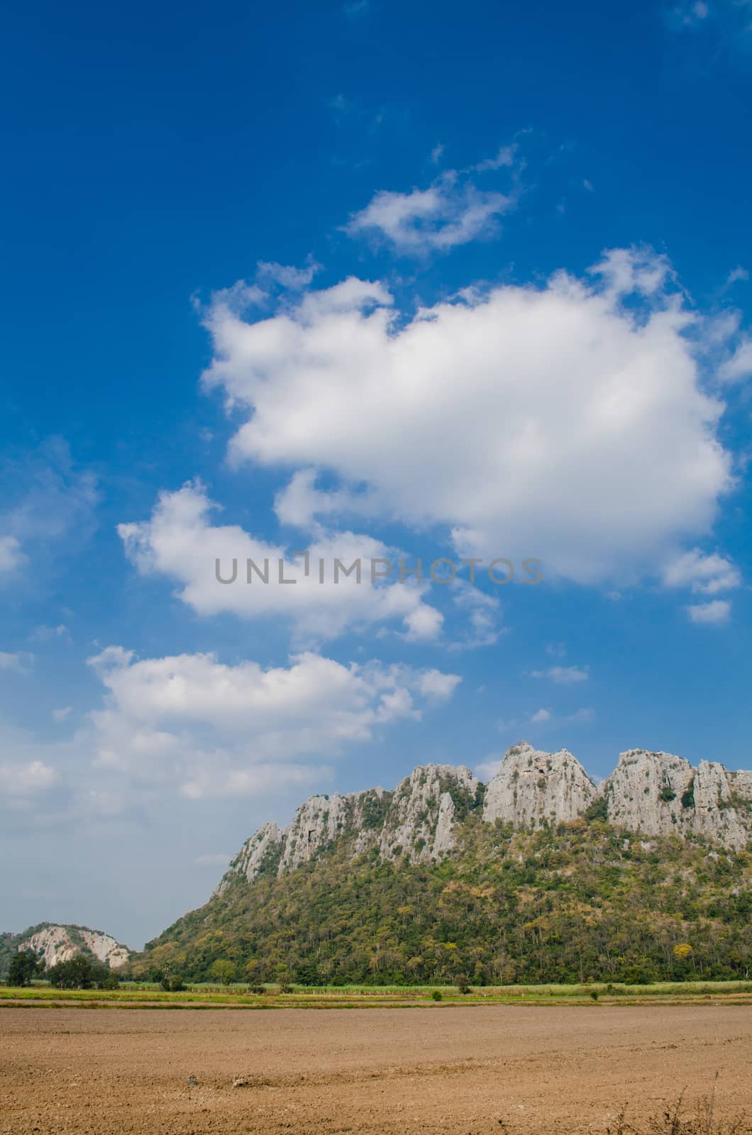 Kao Nor Kao Kawg is limestone mountain in Nakon sawan Province and have green paddy ,blue sky