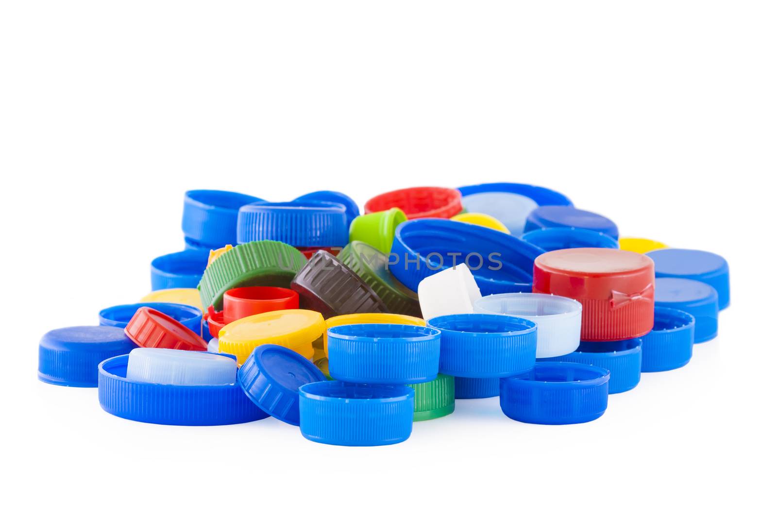 Color plastic bottle caps isolated on white background