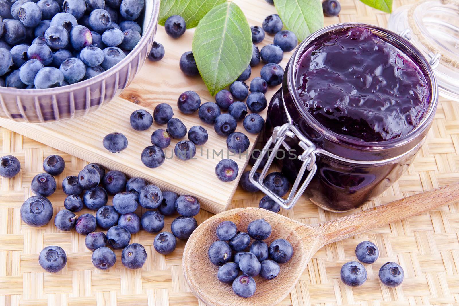 Blueberry jam and fresh fruits on the kitchen table