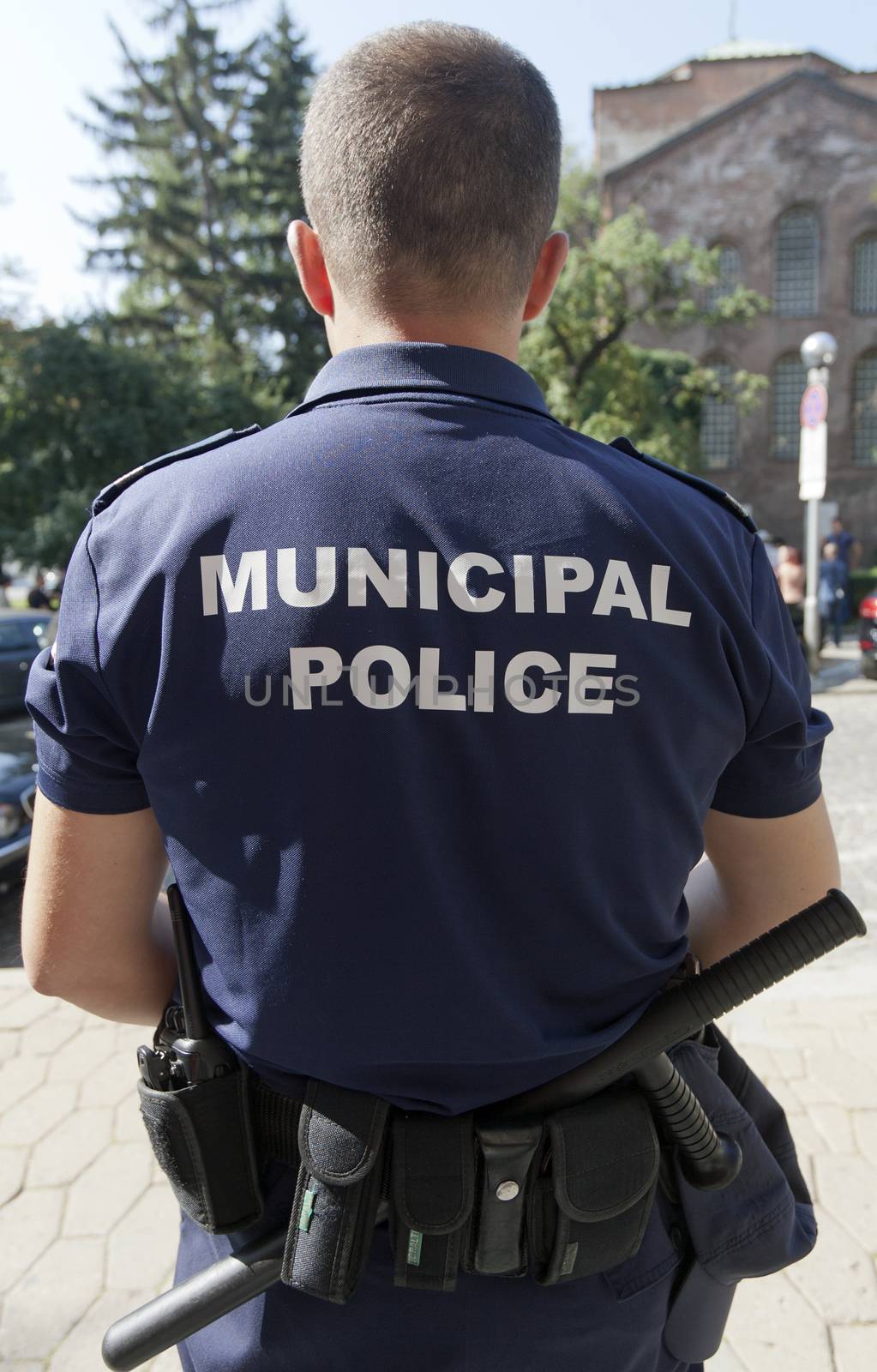 Back view of a municipal policeman.