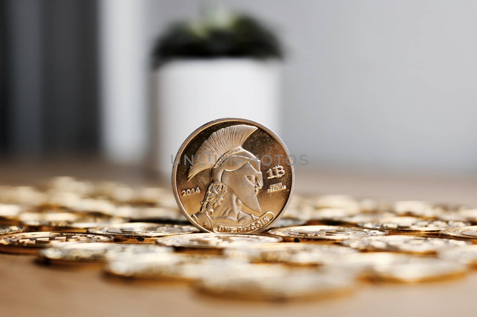 Digital currency physical metal bitcoin coin on the gold money background. Money concept.
