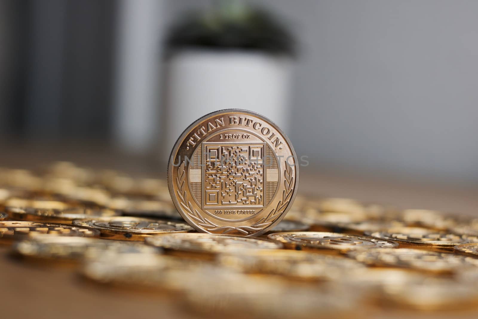 Digital currency physical metal bitcoin coin on the gold money background. Money concept.