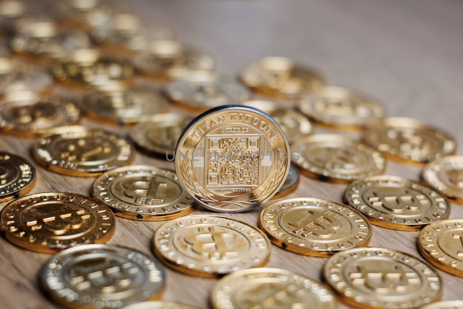Digital currency physical metal bitcoin coin on the gold money background. Money concept.