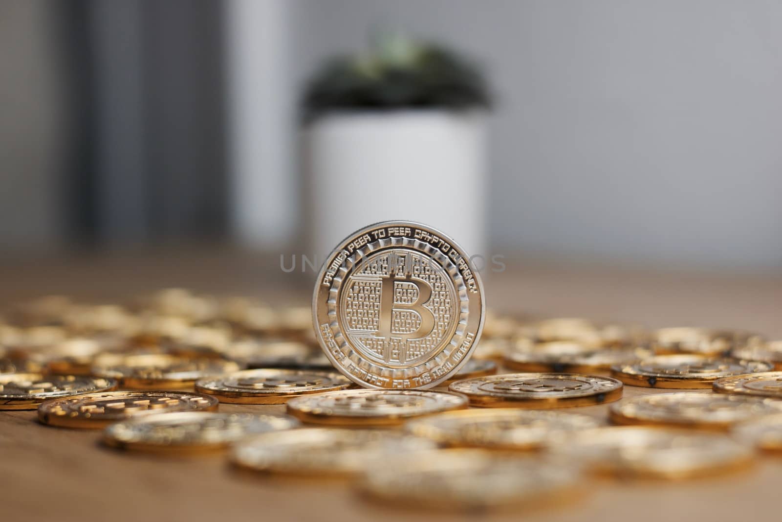 Digital currency physical metal bitcoin coin on the gold money background. Money concept.