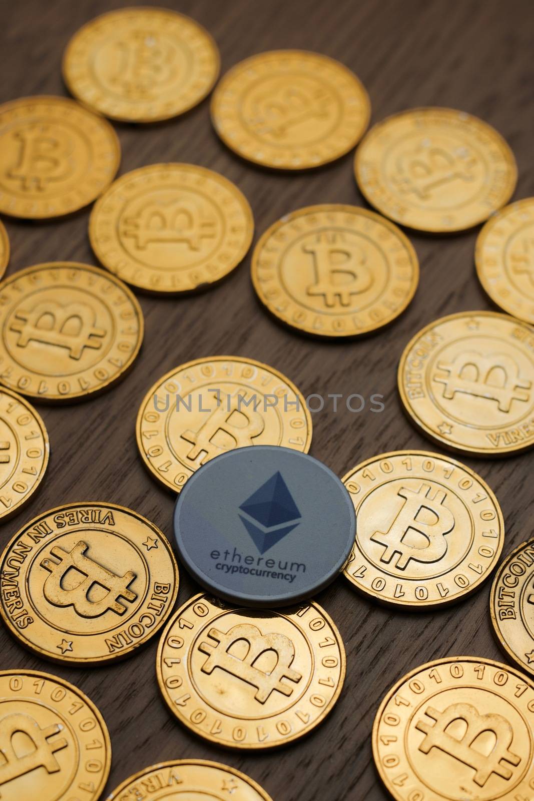 Digital currency physical metal bitcoin coin on the gold money background. Money concept.