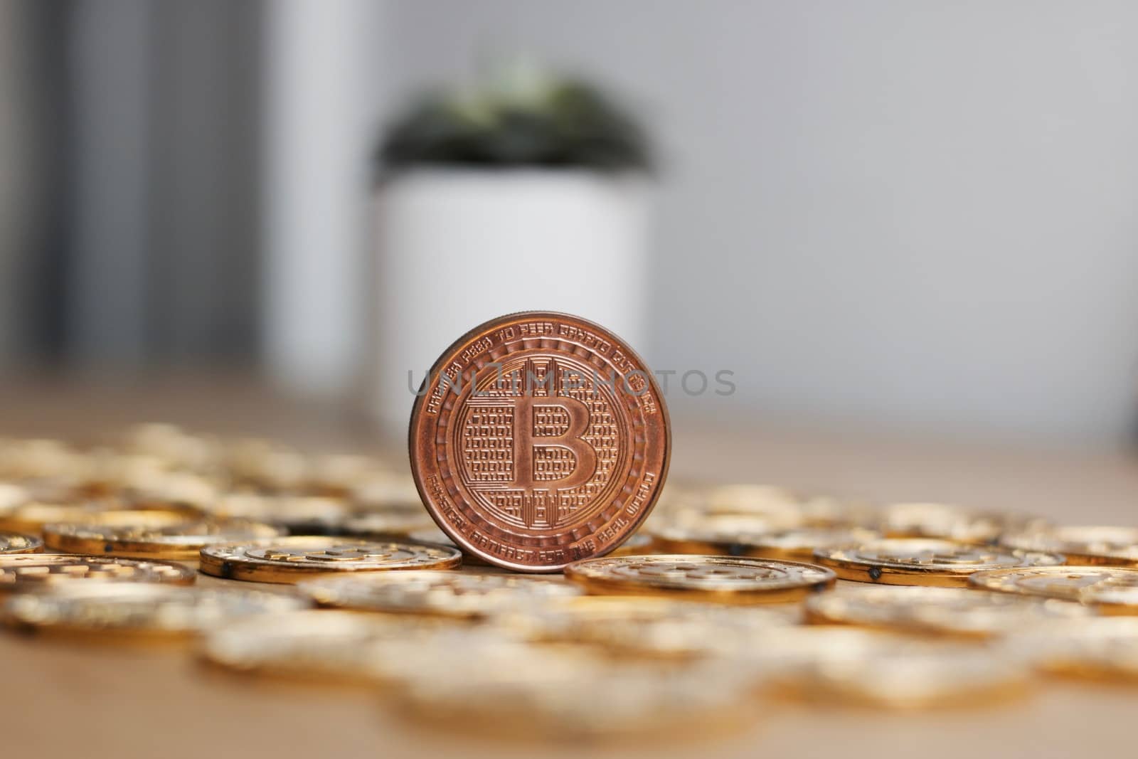Digital currency physical metal bitcoin coin on the gold money background. Money concept.
