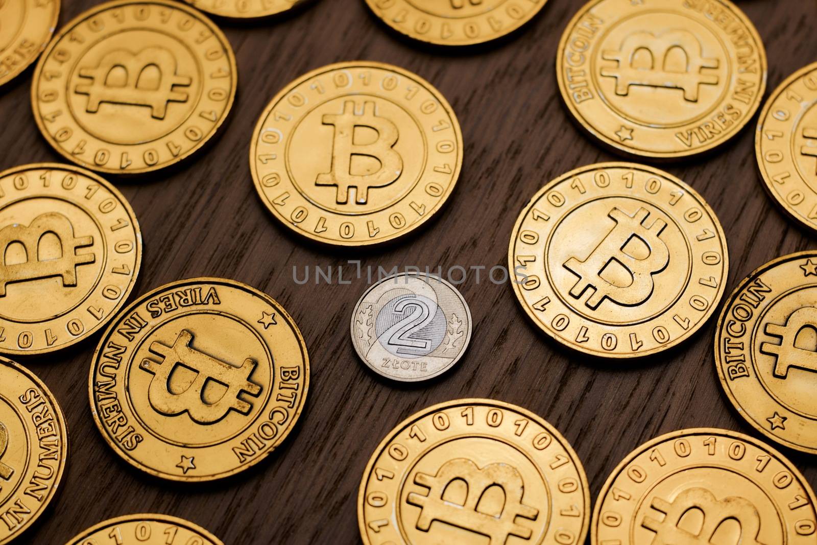Digital currency physical metal bitcoin coin on the gold money background. Money concept.