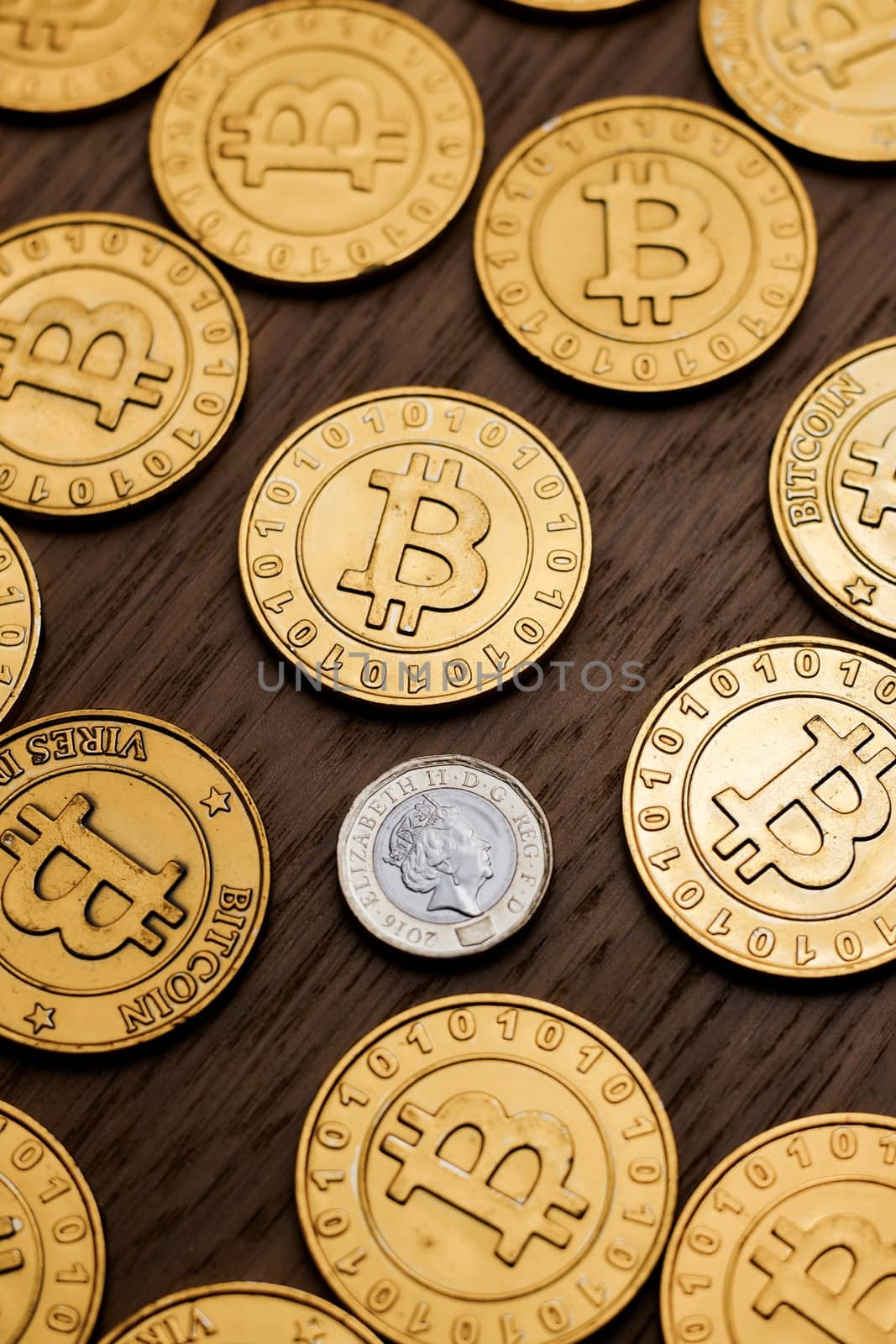 Digital currency physical metal bitcoin coin on the gold money background. Money concept.