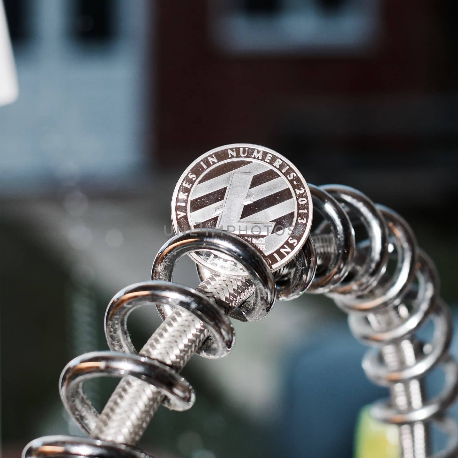 Digital currency physical metal litecoin coin. Cryptocurrency miningn concept.