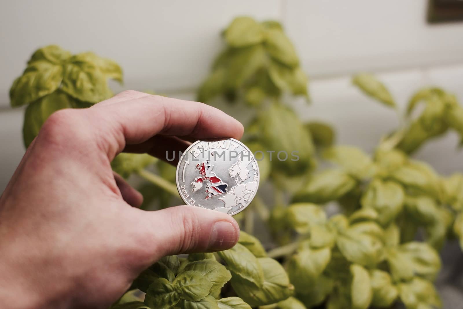 Physical metal brexit coin with map of england. Brexit concept. Europe leaving.