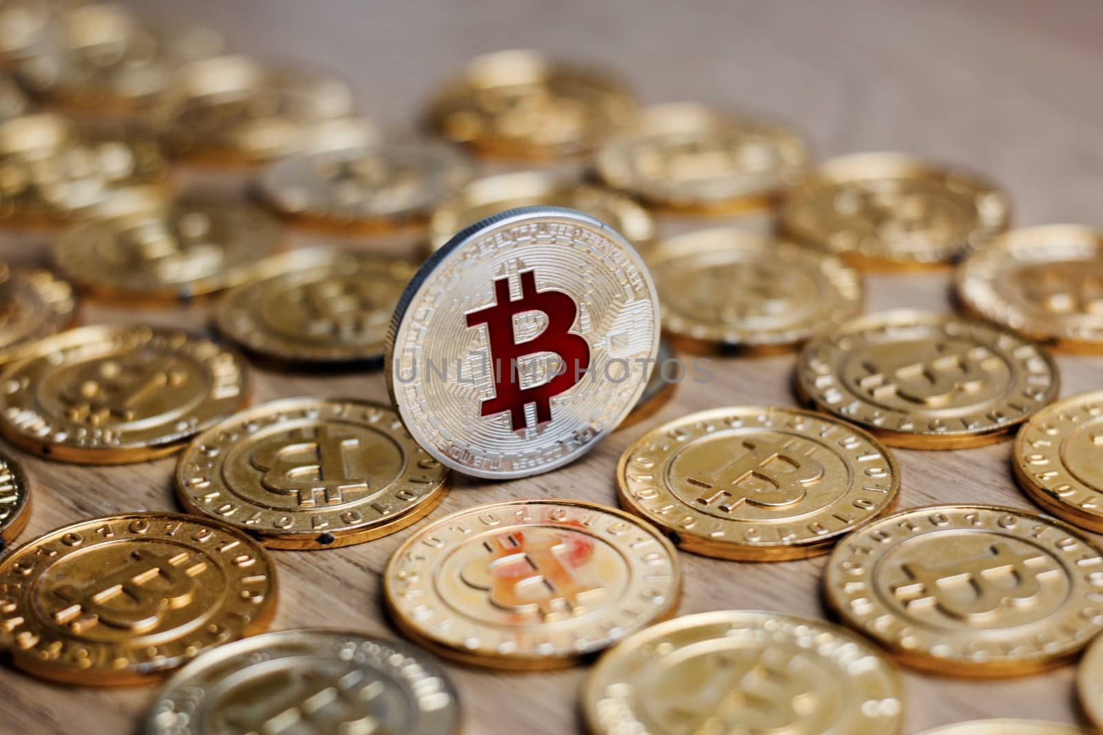 Digital currency physical metal bitcoin coin on the gold money background. Money concept.