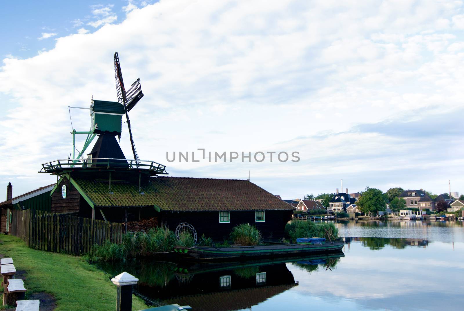 Famous Zaanse Schans Saw Windmill Het Klaverblad with Reflection on Water Early Morning Outdoors