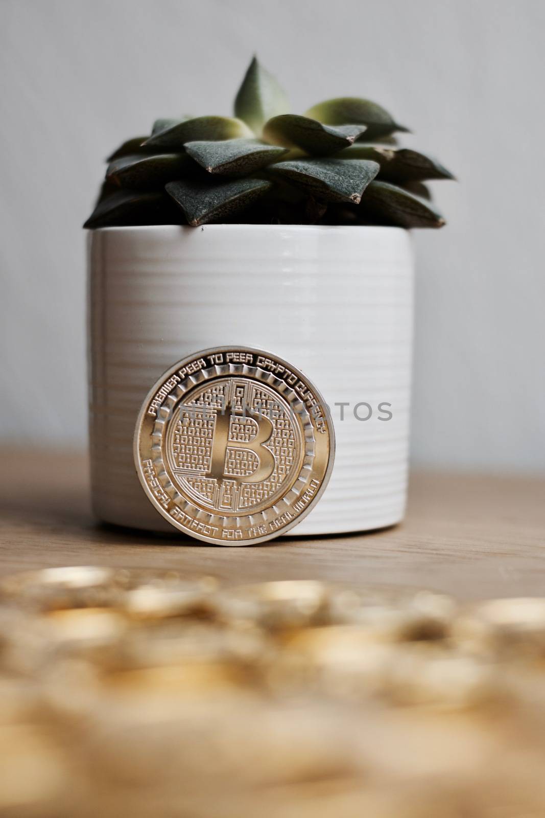 Digital currency physical metal bitcoin coin on the gold money background. Money concept.