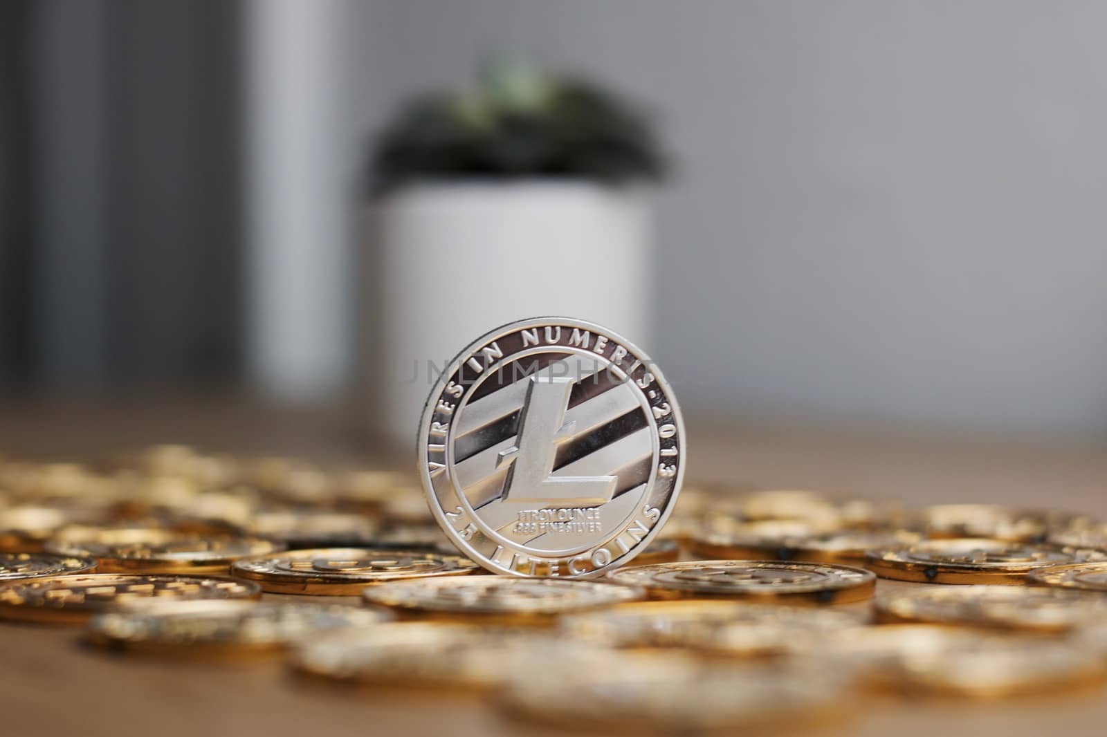 Digital currency physical metal litecoin coin. Cryptocurrency miningn concept.