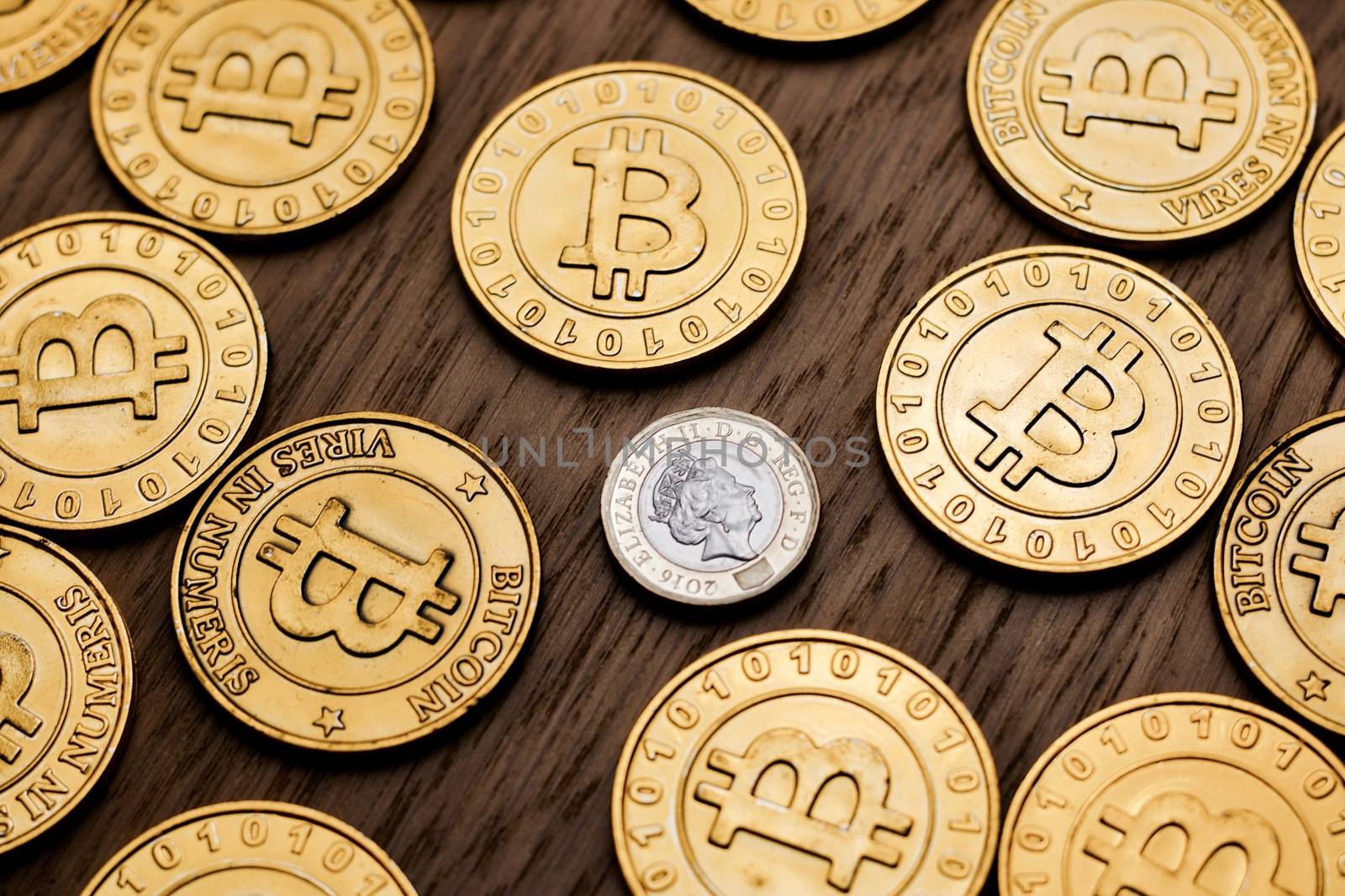 Digital currency physical metal bitcoin coin on the gold money background. Money concept.