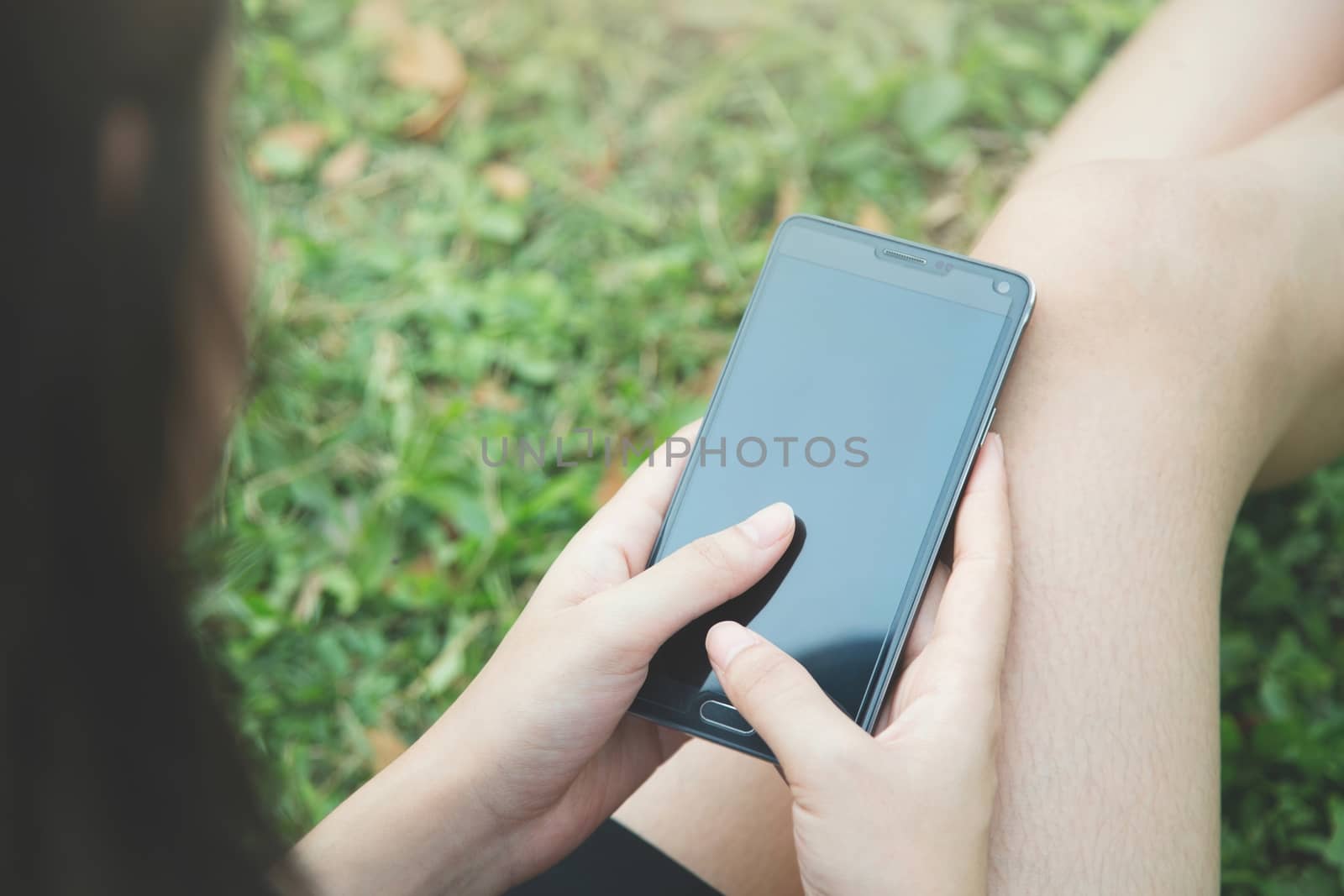 Student young woman using telephone in the parks. by boytaro1428@gmail.com