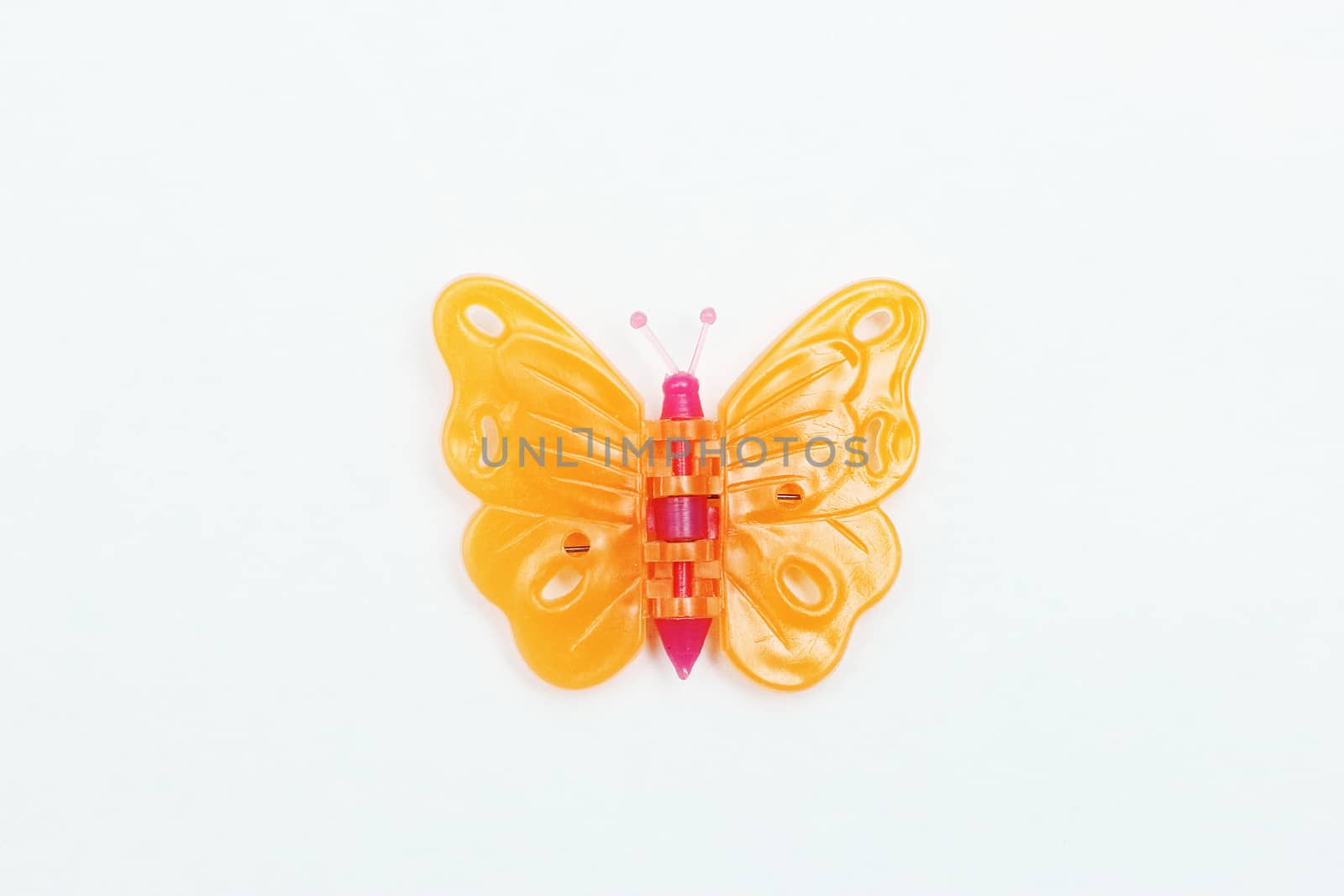 Little decorative butterfly made of plastic. by andsst