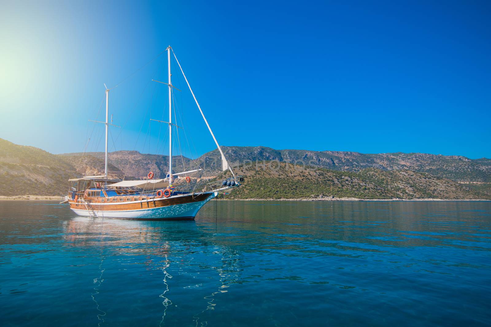 yacht on bay and castle in Kekova, near ruins of the ancient city on the Kekova island, Turkey