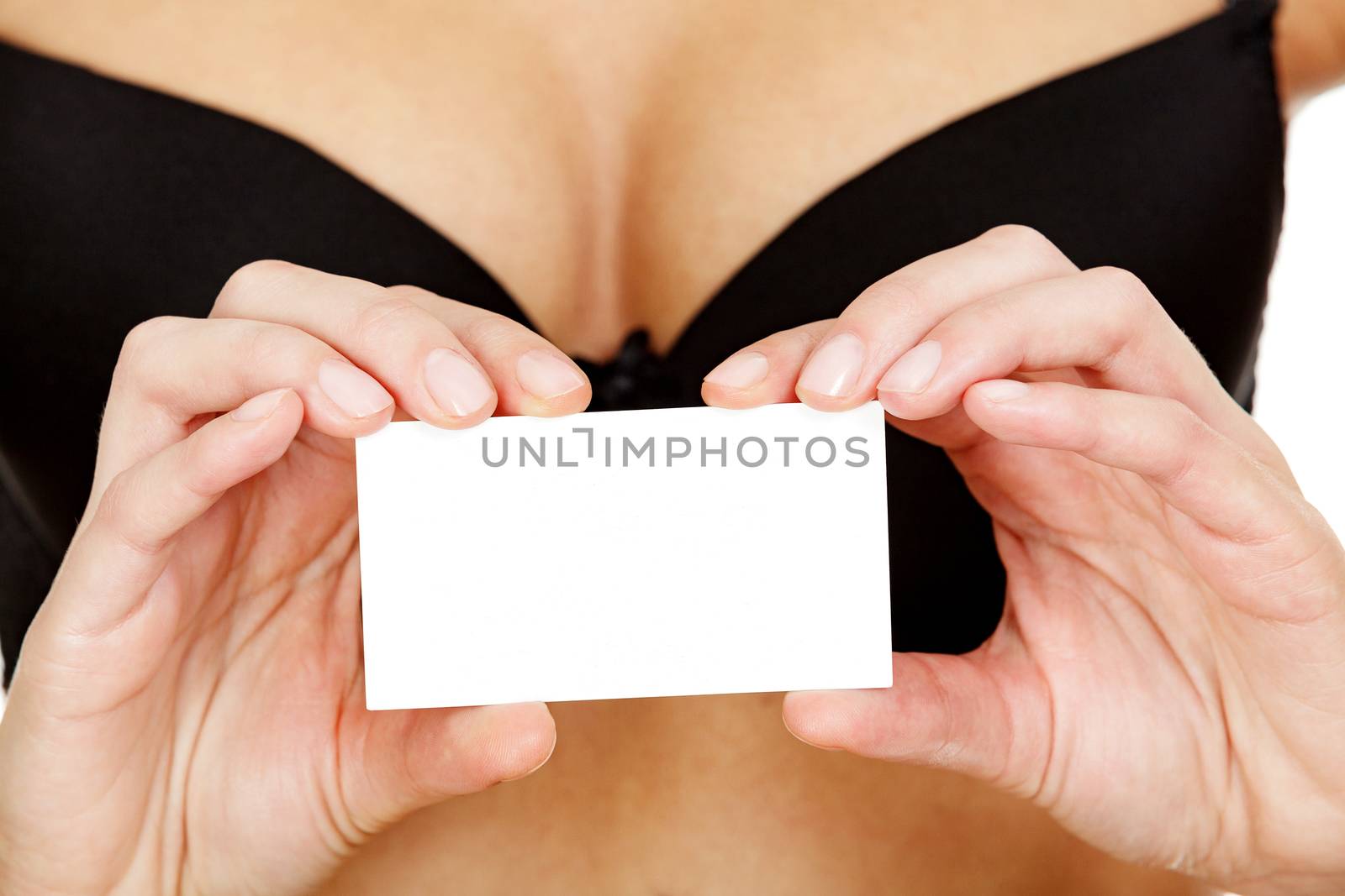 Woman in black bra holds an empty white card with a space for your information